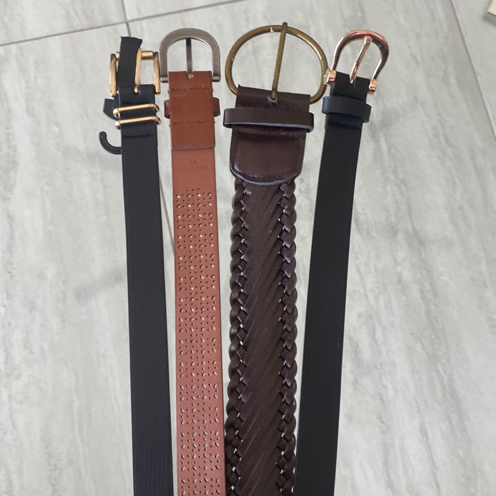A set of Four belts.( 2 Black belts) (1) Light Brown (1) Dark Brown.